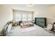 Large room features a yoga mat, 3 windows, and a folding bed at 1051 Jura Ridge Dr, Fuquay Varina, NC 27526
