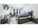 This bedroom features a bed, a dresser and dark curtains at 1051 Jura Ridge Dr, Fuquay Varina, NC 27526
