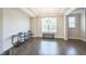 Bright dining room with a tray ceiling, hardwood floors, and a view to the exterior at 1051 Jura Ridge Dr, Fuquay Varina, NC 27526