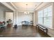 Formal dining room with hardwood flooring, decorative chandelier, and bright natural light at 1051 Jura Ridge Dr, Fuquay Varina, NC 27526