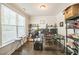 A home office featuring a black desk, rolling chair, and storage shelves at 1051 Jura Ridge Dr, Fuquay Varina, NC 27526