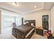 Spacious main bedroom with tray ceilings, windows and dark furnishings at 1051 Jura Ridge Dr, Fuquay Varina, NC 27526