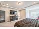 View of the main bedroom featuring a bed and a dresser with a TV at 1051 Jura Ridge Dr, Fuquay Varina, NC 27526