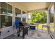 Covered patio with a grill and tables, great for outdoor entertaining and dining at 1051 Jura Ridge Dr, Fuquay Varina, NC 27526