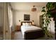 Serene bedroom with natural light, neutral decor, and a decorative fireplace at 1113 Mordecai Dr, Raleigh, NC 27604