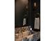 Stylish powder room featuring dark walls, a marble sink, and unique lighting fixtures at 1113 Mordecai Dr, Raleigh, NC 27604