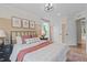 Cozy bedroom with a comfortable bed, stylish decor, and natural light streaming through the window at 1165 Tembrook Dr, Mebane, NC 27302