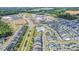 Aerial view of the neighborhood showing pool, retail area, and surrounding woods at 1208 Brown Velvet Ln, Apex, NC 27523