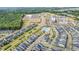 A high angle neighborhood view showcasing streets, landscaping, pool and nearby retail at 1208 Brown Velvet Ln, Apex, NC 27523