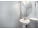 Small half bathroom with gray walls and pedestal sink at 1208 Brown Velvet Ln, Apex, NC 27523
