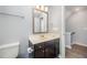 Bathroom featuring a single sink with a dark brown vanity at 1208 Brown Velvet Ln, Apex, NC 27523