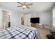 Bedroom featuring a ceiling fan, a tv and attached bathroom at 1208 Brown Velvet Ln, Apex, NC 27523