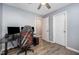 Bedroom featuring a ceiling fan and a large gaming chair at 1208 Brown Velvet Ln, Apex, NC 27523