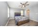 Bedroom featuring a wooden bed frame, ceiling fan and windows at 1208 Brown Velvet Ln, Apex, NC 27523