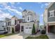 Charming two-story home with a turret, attached garage, and manicured front lawn at 1208 Brown Velvet Ln, Apex, NC 27523
