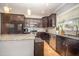 Modern kitchen with granite countertops, stainless steel appliances, and hardwood floors at 1208 Brown Velvet Ln, Apex, NC 27523