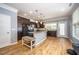 Well-appointed kitchen with an island, stainless steel appliances, and hardwood floors at 1208 Brown Velvet Ln, Apex, NC 27523
