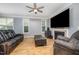 Inviting living room with a fireplace, stylish seating, and bright windows at 1208 Brown Velvet Ln, Apex, NC 27523