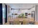 Bright kitchen view with an open layout showcasing stainless steel appliances at 121 Seagraves Creek Ln, Holly Springs, NC 27540