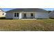 Exterior of home featuring a back patio and large backyard at 128 Oakfield Trace Dr, Four Oaks, NC 27524