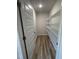 Walk-in pantry with wood flooring and wire shelving for optimal storage and organization at 128 Oakfield Trace Dr, Four Oaks, NC 27524