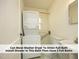 Full bathroom with laundry setup at 1410 Shawnee St, Durham, NC 27701