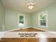 Bedroom featuring two windows at 1410 Shawnee St, Durham, NC 27701