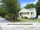 A yellow bungalow offering it's own driveway and off-street parking at 1410 Shawnee St, Durham, NC 27701