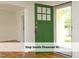 Inviting entryway with green door, leading into a bright and airy interior at 1410 Shawnee St, Durham, NC 27701