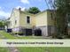 A view of the side of the home with crawl space access at 1410 Shawnee St, Durham, NC 27701