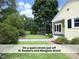 Well-manicured front yard and garden of the home is on a quiet street, just off N. Roxboro and Mangum street at 1410 Shawnee St, Durham, NC 27701