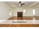 Bright living room with beautiful hardwood floors, brick fireplace and ceiling fan at 1410 Shawnee St, Durham, NC 27701