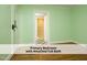 Primary bedroom features en-suite bathroom at 1410 Shawnee St, Durham, NC 27701