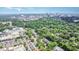 Wide angle aerial view showcasing the city skyline, lush trees and suburban homes at 1414 Park Dr, Raleigh, NC 27605