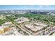Expansive aerial view showcasing the vibrant city skyline, lush green trees, and bustling commercial areas at 1414 Park Dr, Raleigh, NC 27605