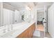 Bathroom with double sinks, a large mirror, and access to the bedroom at 1414 Park Dr, Raleigh, NC 27605