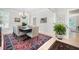 Elegant dining room with hardwood floors, large rug, and stylish chandelier at 1414 Park Dr, Raleigh, NC 27605