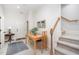 Inviting dining area with a wooden table and chairs, art, and a staircase at 1414 Park Dr, Raleigh, NC 27605