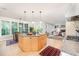 Spacious eat-in kitchen with a large island with granite countertops, wood cabinets, and pendant lights at 1414 Park Dr, Raleigh, NC 27605