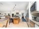 Modern eat-in kitchen with stainless steel appliances, granite countertops, and light wood cabinets at 1414 Park Dr, Raleigh, NC 27605