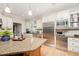 Well-equipped kitchen featuring stainless steel appliances, a built-in microwave, and granite countertops at 1414 Park Dr, Raleigh, NC 27605