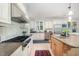 Spacious kitchen featuring stainless steel appliances and an island with a sink at 1414 Park Dr, Raleigh, NC 27605