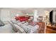 Open living room with a red sofa, patterned armchairs, and plush carpeting at 1414 Park Dr, Raleigh, NC 27605