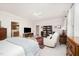Bright main bedroom with TV, doorway to ensuite bath, and ceiling fan at 1414 Park Dr, Raleigh, NC 27605
