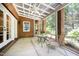 Screened porch features brick pillars and an outdoor seating area at 1414 Park Dr, Raleigh, NC 27605