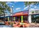 Outdoor patio with tables and umbrellas at The Flying Biscuit Cafe at 1414 Park Dr, Raleigh, NC 27605