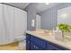 Charming bathroom featuring a vanity with ample storage and a shower with curtain at 1523 Oak Forest Dr, Hillsborough, NC 27278