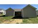 Home exterior featuring a grass backyard at 154 Oakfield Trace Dr, Four Oaks, NC 27524