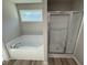 Bathroom with a shower and large soaking tub at 154 Oakfield Trace Dr, Four Oaks, NC 27524