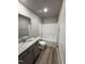 Bright bathroom featuring a vanity with modern fixtures and a shower-tub combo at 154 Oakfield Trace Dr, Four Oaks, NC 27524